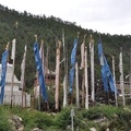 Stupas and prayer flags near a monastery