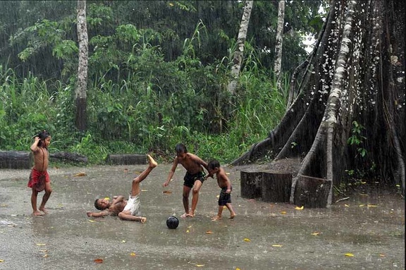 Kids playing football in the rain on monkey island 