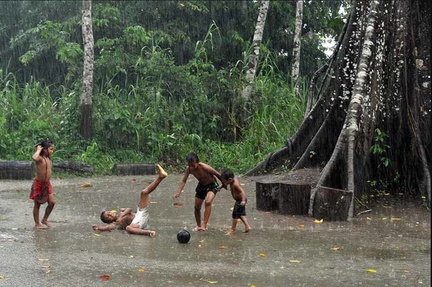 Kids playing football in the rain on monkey island 