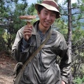 Orgyen Rinchen with one of many matsutake he picked that morning.