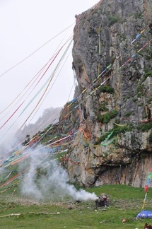 Pilgrims burning incense, here shukpa, juniper bows at Trakaniri in Lithang.