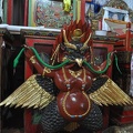The Garuda (Tibetan: Khyung), biding down on a snake, will be mounted behind the head of the Buddha statue.