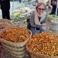 Kathy Welsh smiling at lots of chanterelles! What a nice fruity smell such a pile of Chanties has!