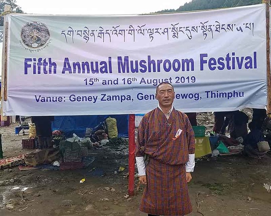 Banner of the Genekha Muhsroom festival with Dawa Penjor of the National Mushroom Center