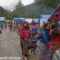 People at the tent stores at the Muhsroom festival in Genekha